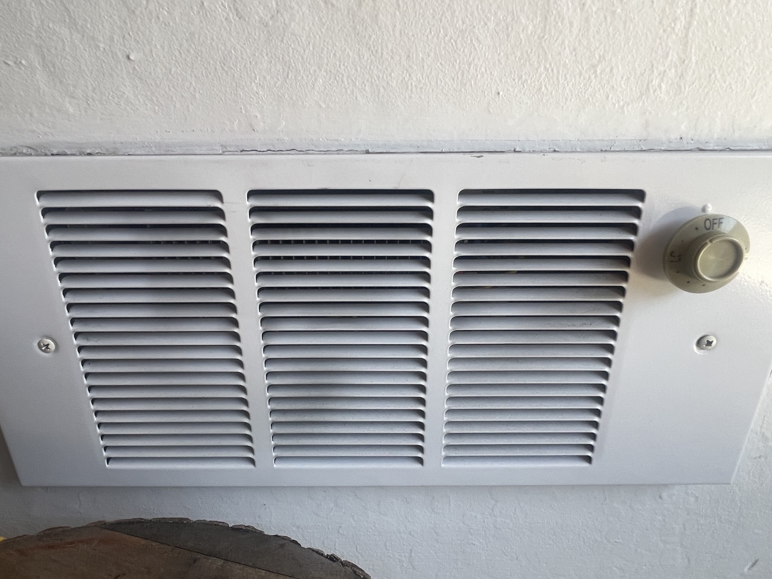 Wall-mounted electric heater grille and control knob